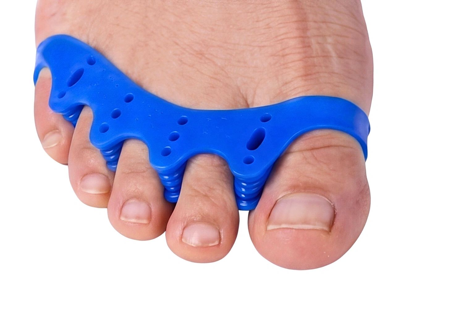 Man relaxing on couch wearing ToeSet gel toe separators — Reset. Relax. Repeat.